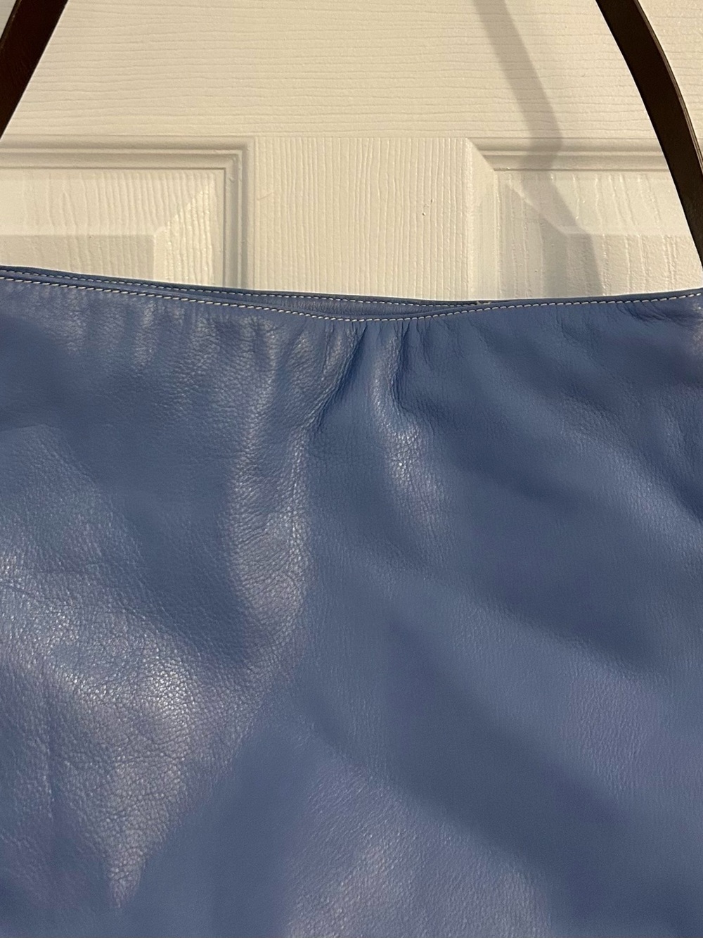 Prague periwinkle blue leather shoulder bag, featuring a minimalist slouchy hobo